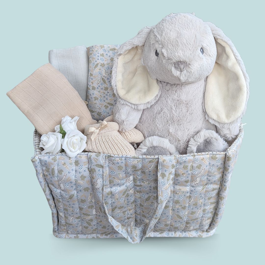 baby boy hamper with gifts including bunny soft toy & muslins in a soft padded bag.