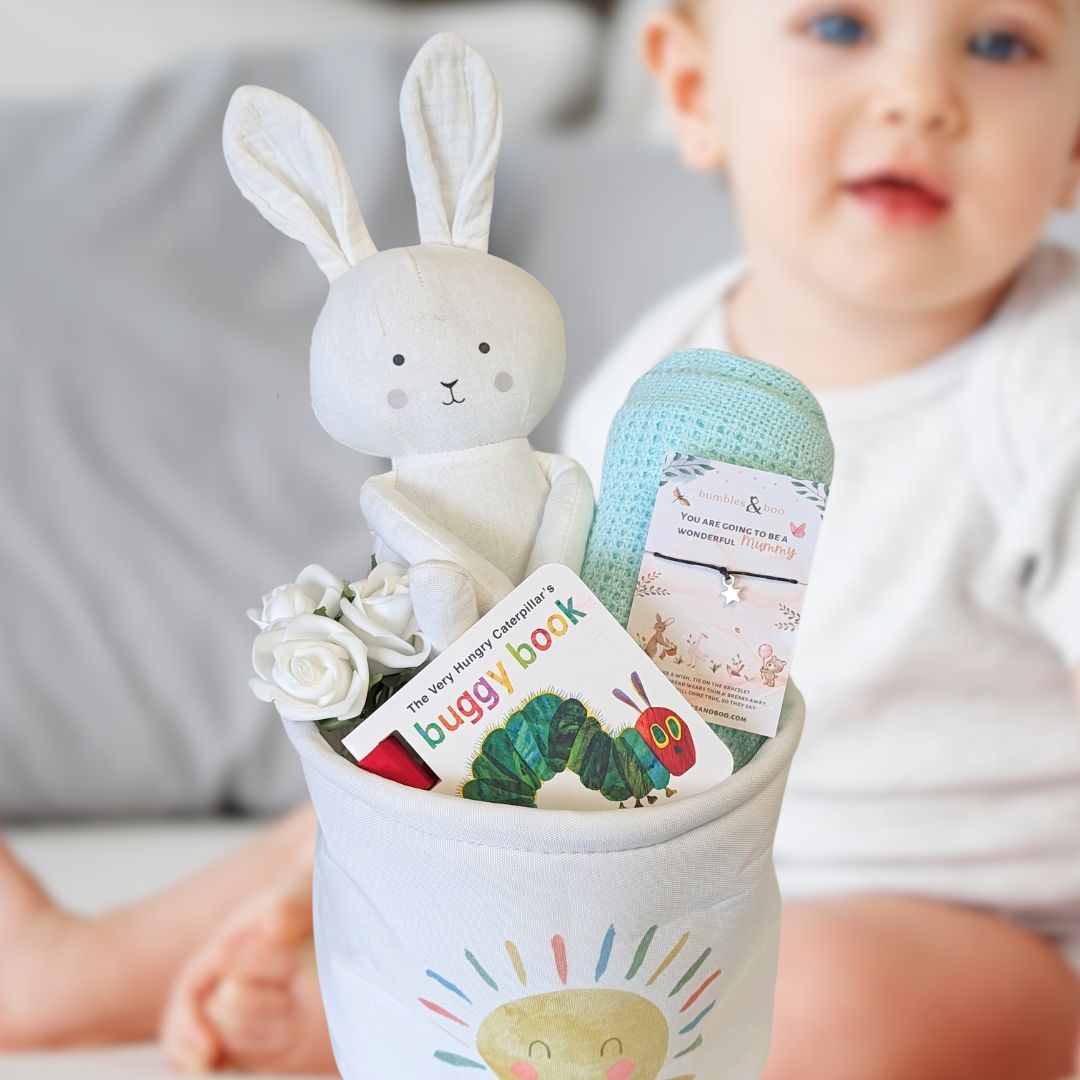 baby hamper gift with bunny, book and blanket.