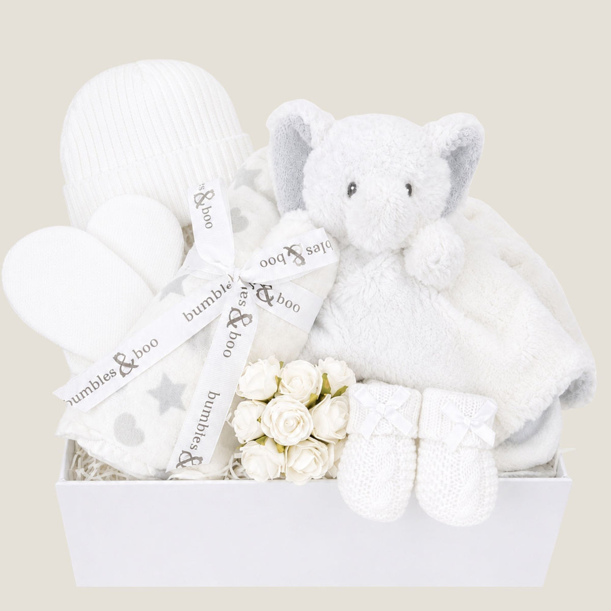 Baby hamper box packed with white gifts to welcome a newborn baby