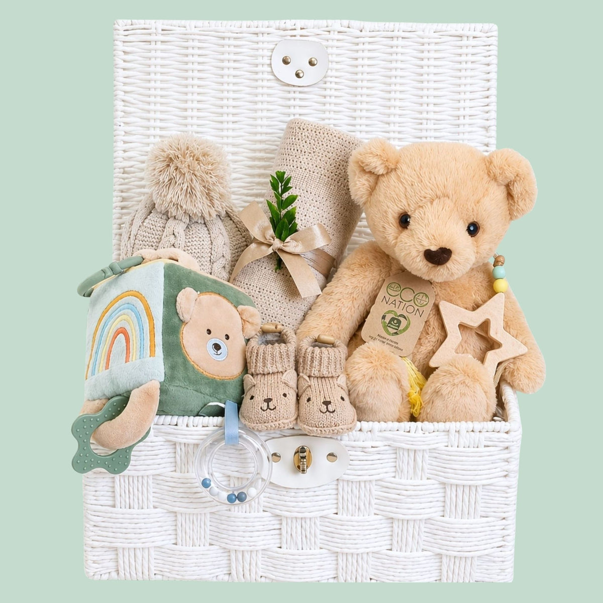 baby hamper gift basket with a teddy bear, blanket and sensory toys