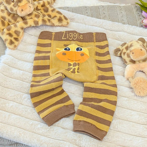 Giraffe baby leggings with an orange and brown stripe.