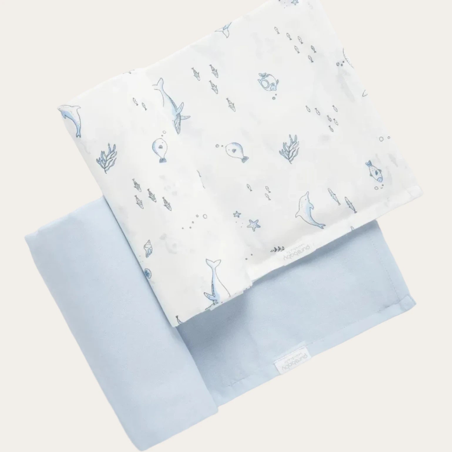 Baby muslin wraps in nautical blue tones, crafted from breathable cotton muslin for swaddling and everyday baby care