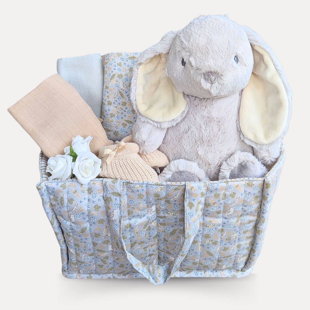 Nappy caddy baby hamper with gifts for baby.