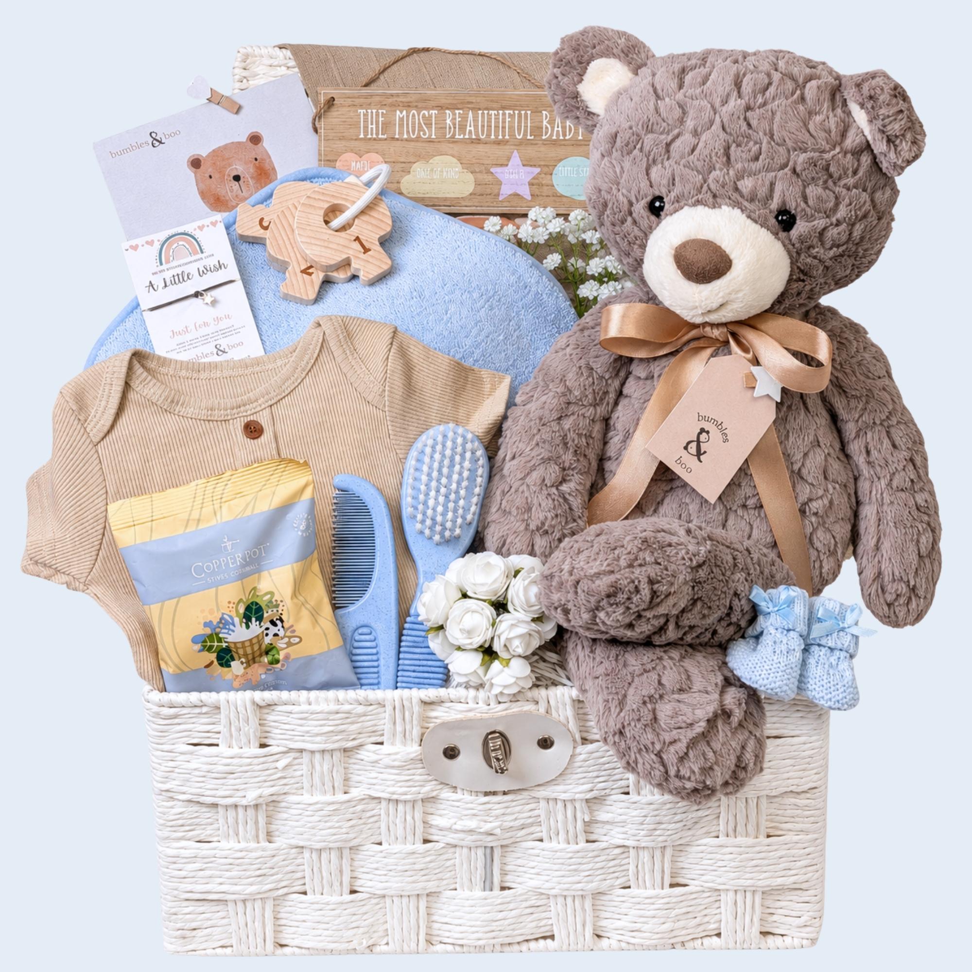 Baby shower hamper gifts with a large teddy bear and fudge for the mum to be to enjoy