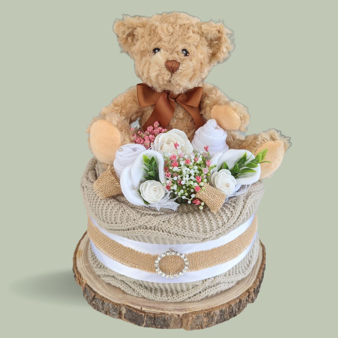 baby shower nappy cake gift in brown unisex design with teddy bear topper.