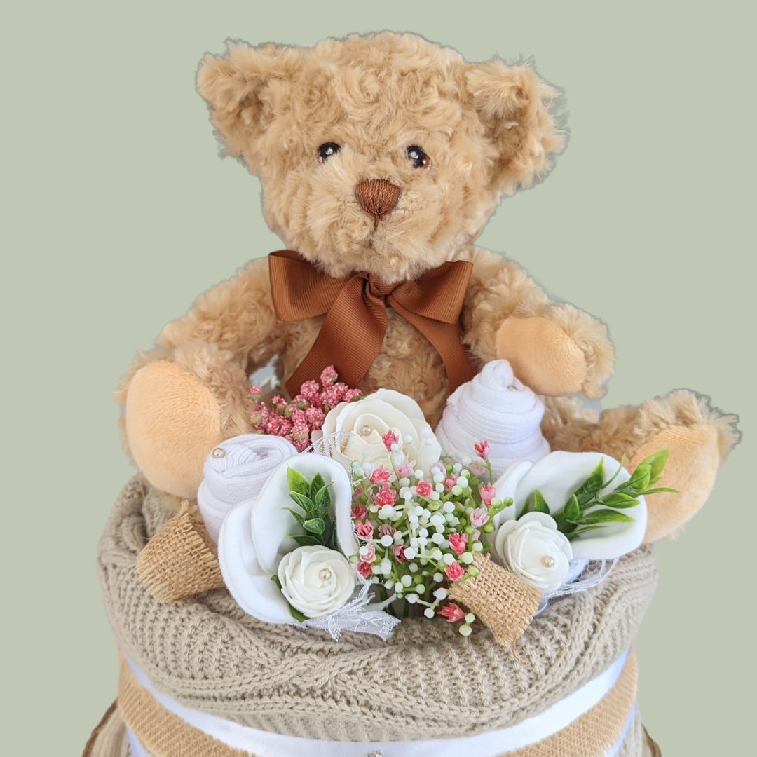 baby shower nappy cake in unisex. Includes blanket, teddy bear, nappies, muslins, mittens and socks.