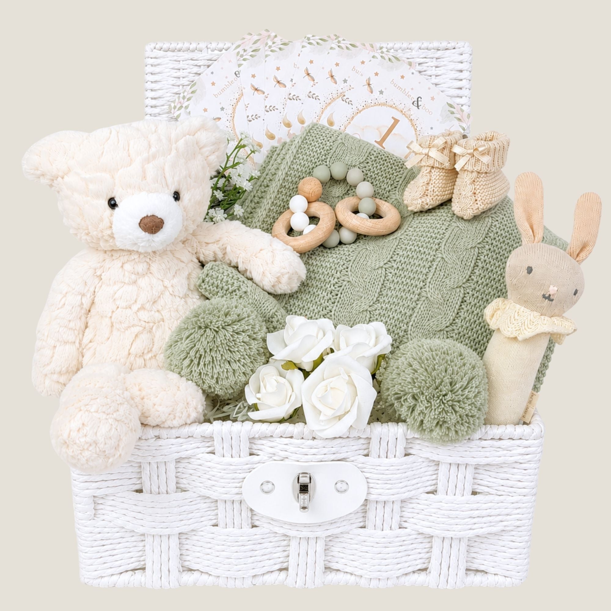 Baby shower gifts basket with sage blanket and teddy bear