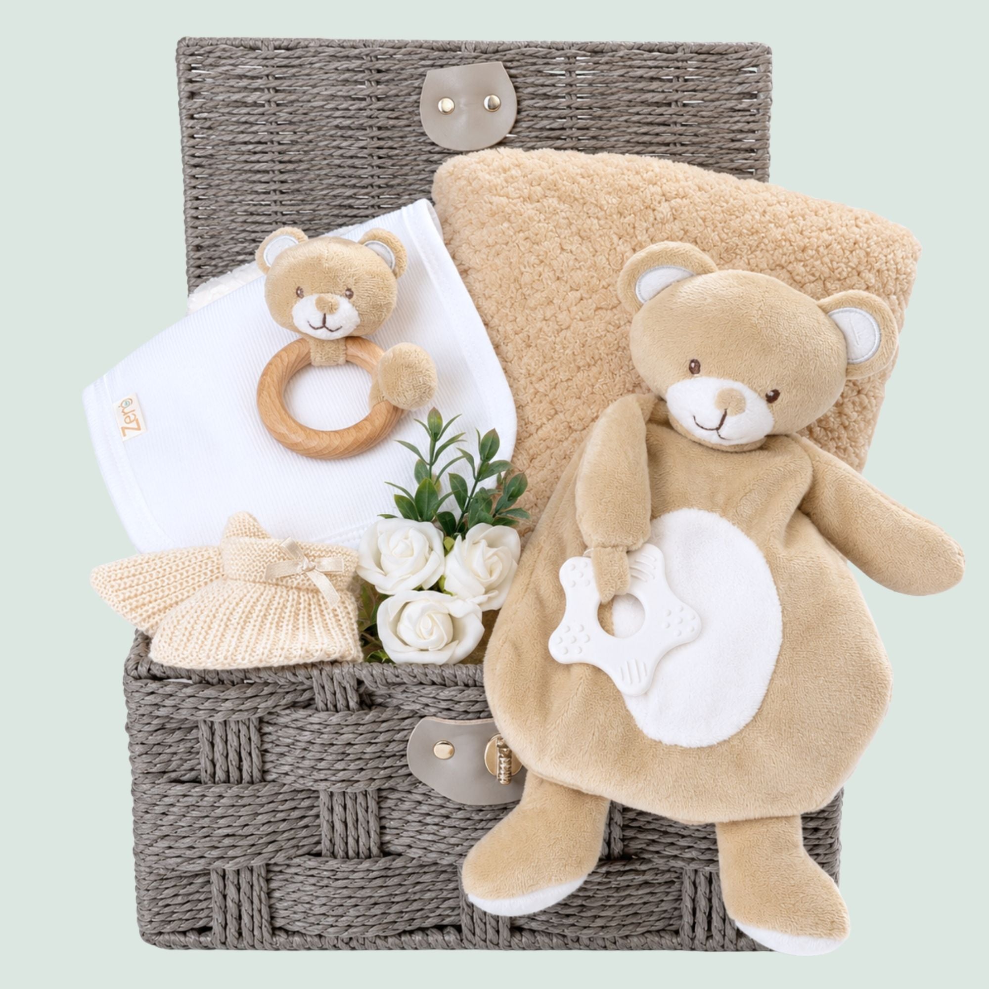 Baby shower gifts hamper basket. This Bumbles and Boo hamper includes a teddy baby comforter and beige blanket.