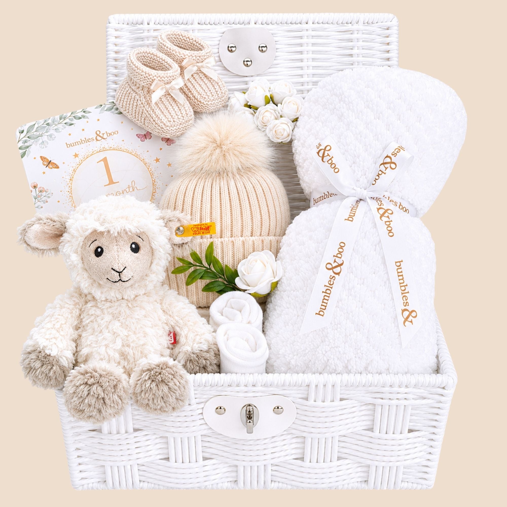 Baby shower gifts hamper with white baby blanket and steiff cuddly lamb