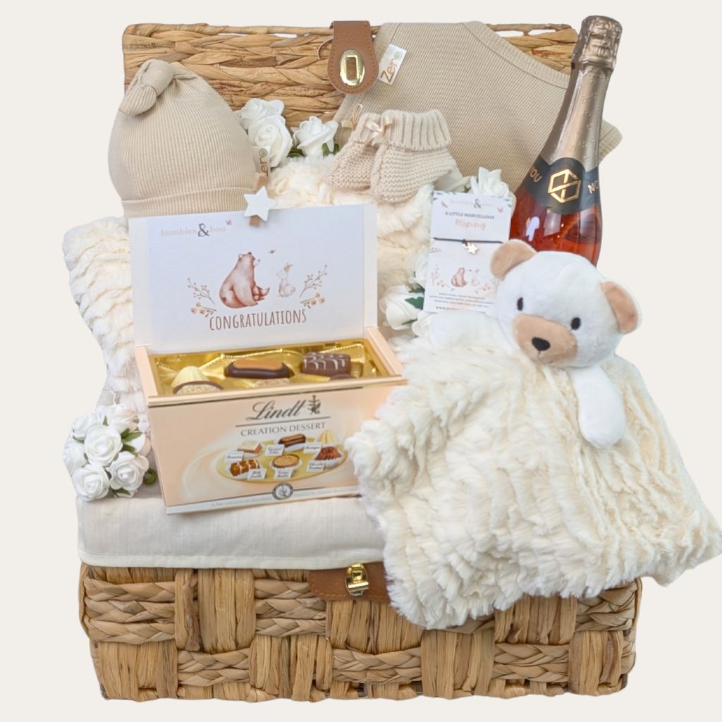 Large baby shower gifts hamper containing cream bear comforter and chocolate congratulations pregnancy treats. 