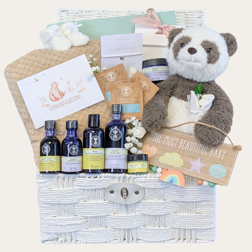 Luxury baby shower pamper hamper with gifts including Neals Yard mum and baby skincare and panda soft toy. Designed by Bumbles and Boo