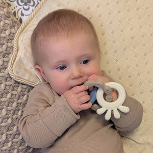 baby silicone teething toy in blue and beige