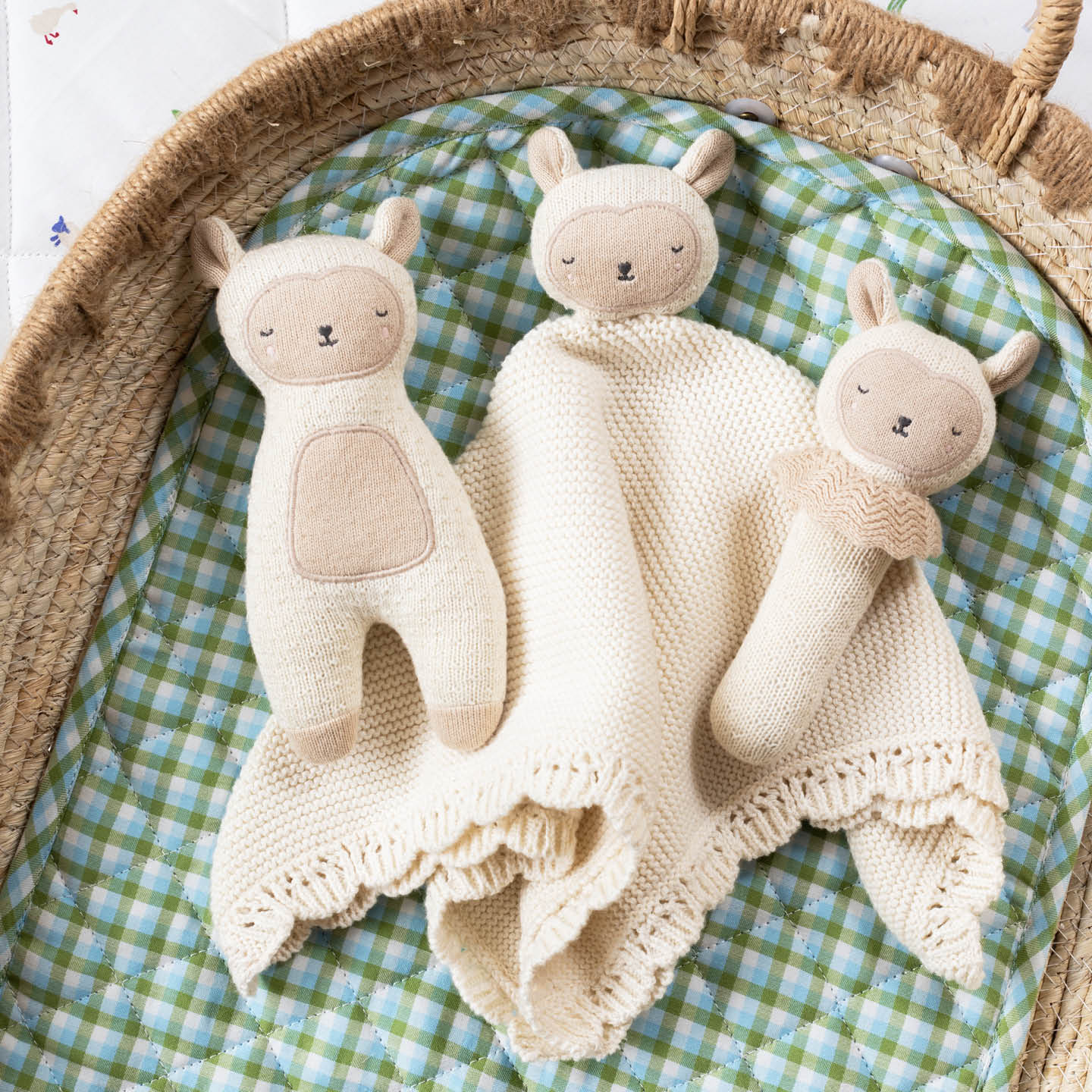 Cream organic cotton Sleepy Sheep stick rattle baby toy with knitted texture and soft embroidered face.
