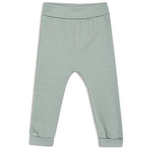 Baby unisex cotton joggers in soft green with elasticated waist