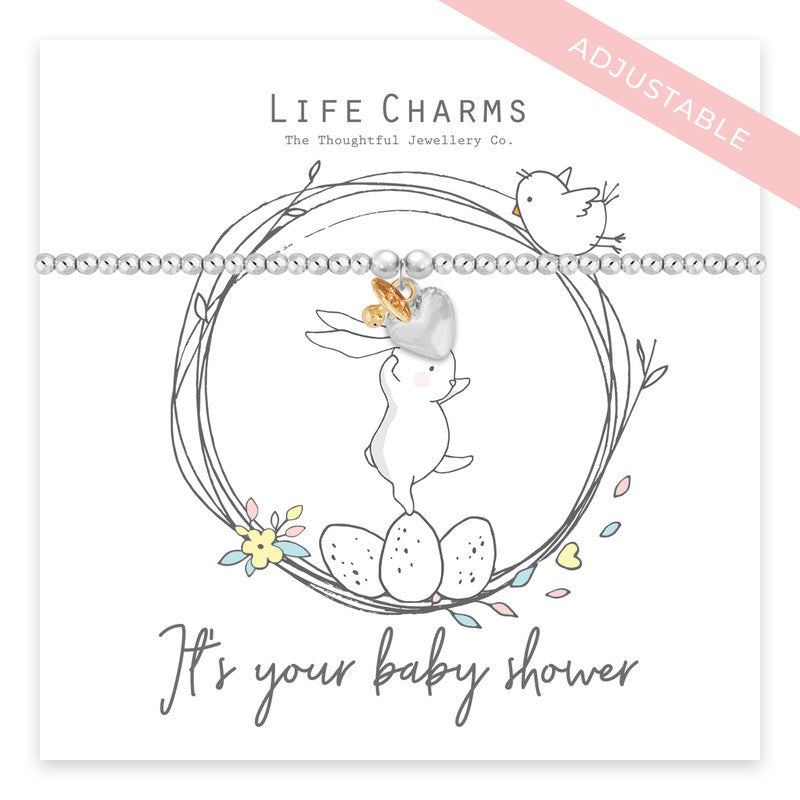 Silver plated bracelet with a dummy and heart charm with the sentiment &#39;its your baby shower&#39; written on the card