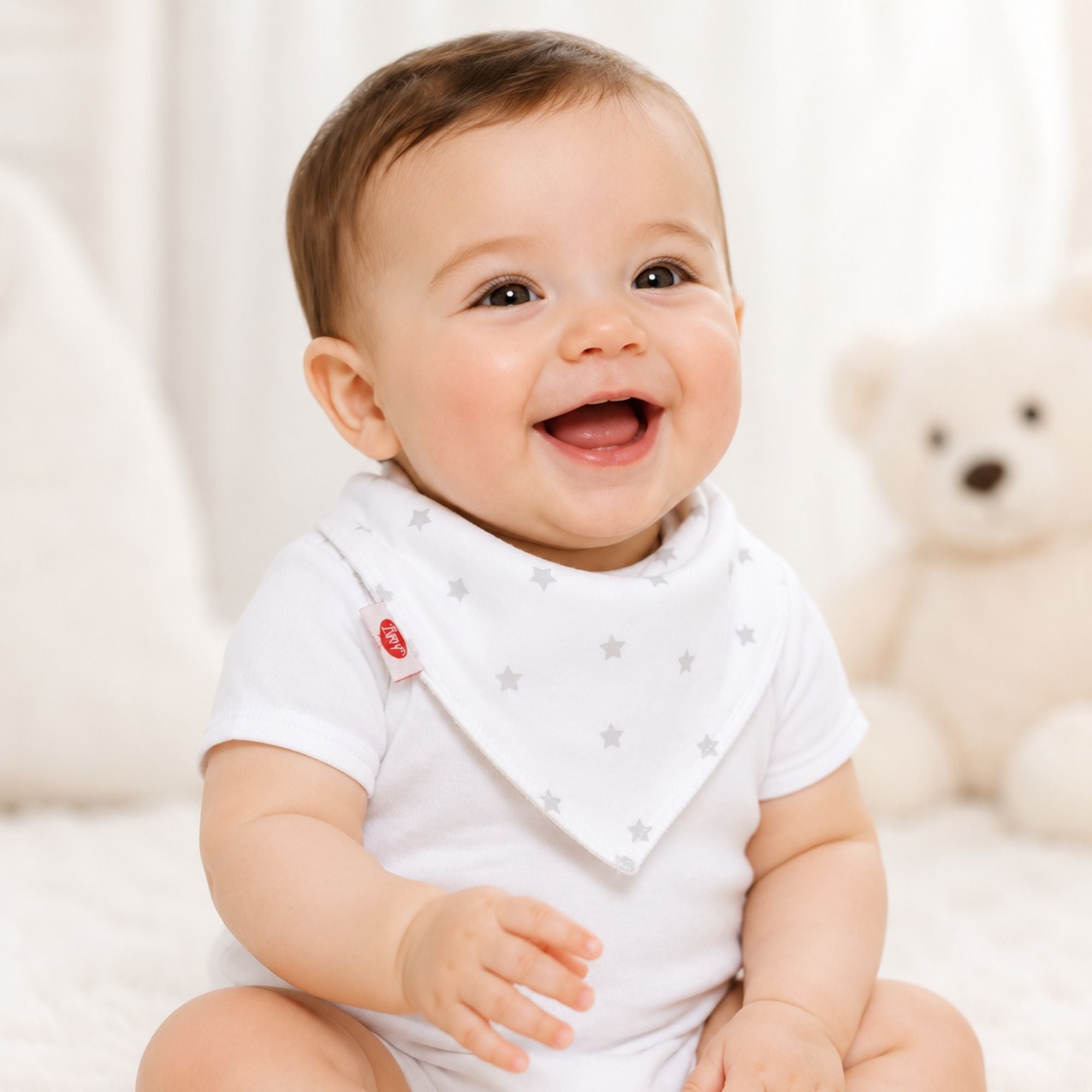 White and grey bandana bib for a baby