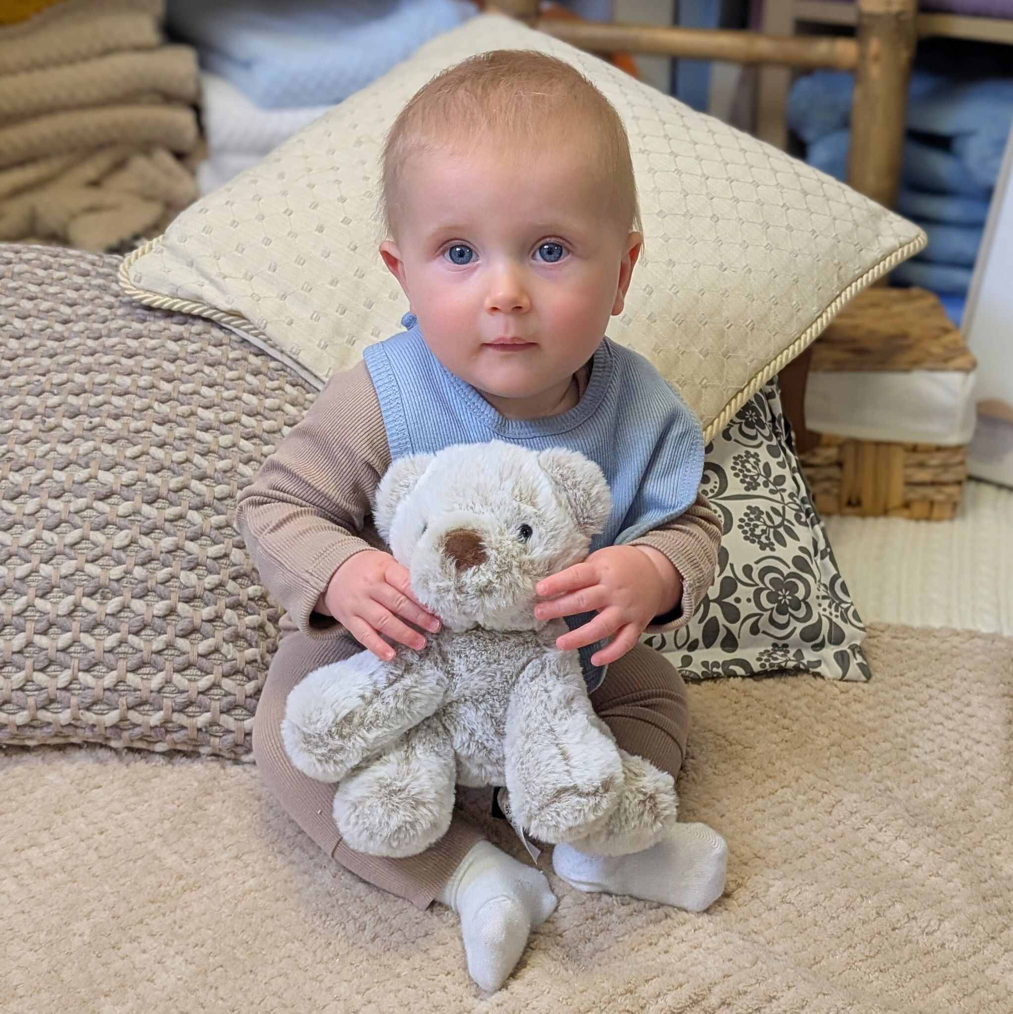 soft teddy bear which is sitting and very sweet