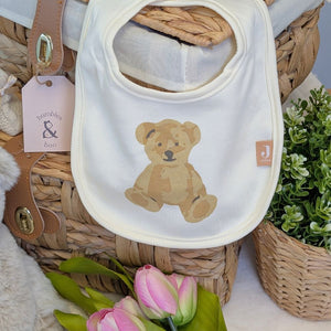 white bib with a cute brown bear on the front