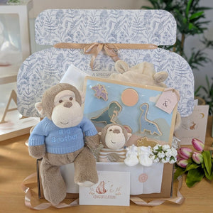 Baby gift set for a newborn and big brother with plush monkey, jigsaw and baby dressing gown.