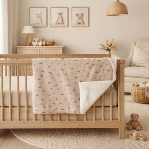 Organic cream and brown baby blanket with a bird theme.