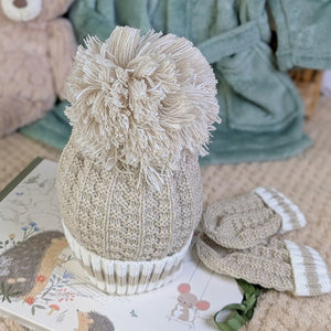 Knitted hat and mittens set in biscuit colour with a pompom