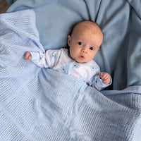 Blue cotton cellular newborn baby blanket.