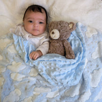 Blue clouds baby blanket with bubble back.