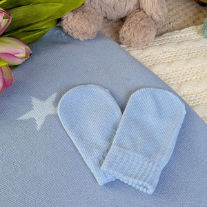 Light blue baby knit mittens.