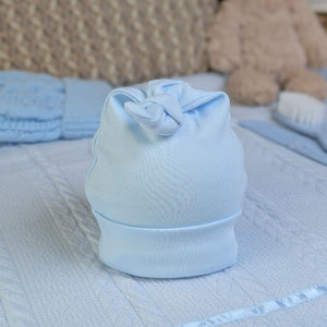 Light blue baby cotton hat with a knot.