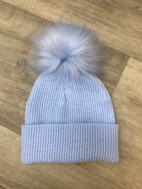 Blue knit pom pom hat