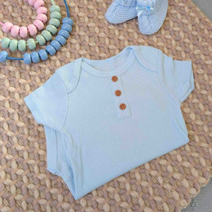 Blue baby boy vest with ribbed design and buttons.