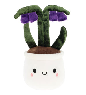 Plush toy resembling a potted plant with green leaves and purple flowers on a white background