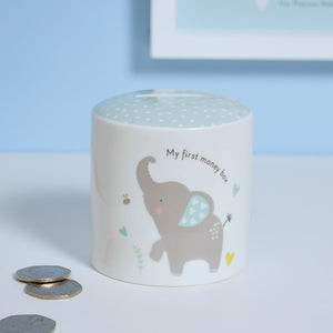 White ceramic baby boy money box with blue elephant design and "My first money box" text