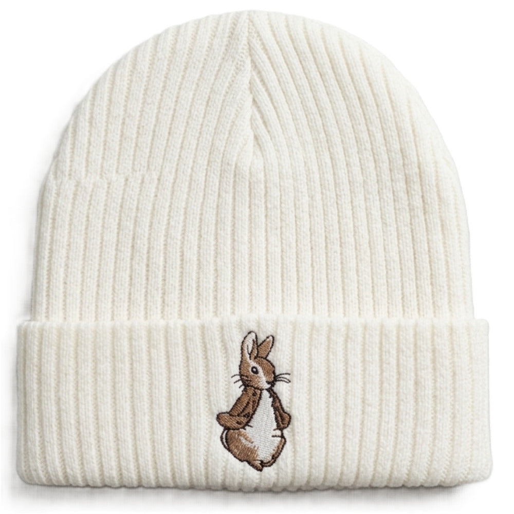 Brown knitted baby hat with embroidered bunny detail close-up