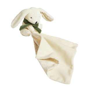 Bunny comforter with flowing cream blanket and patterned corner against white
