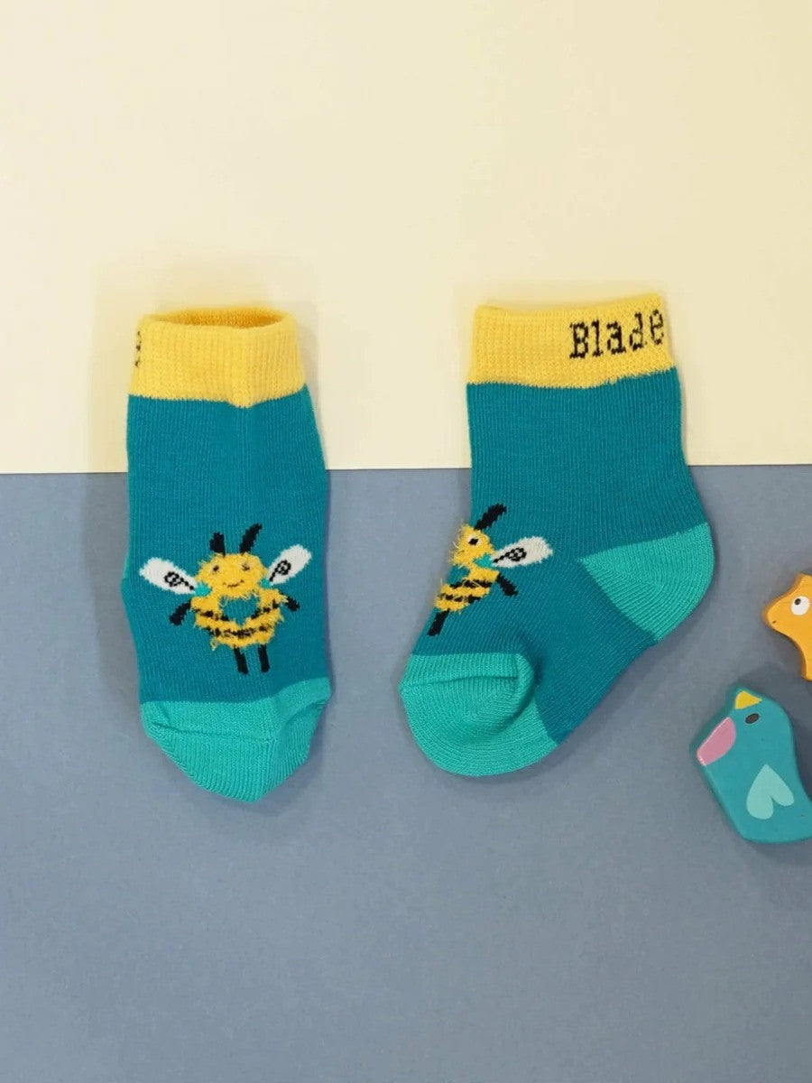 Teal socks with yellow bumble bees