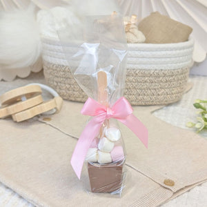 Marshmallow and chocolate treat in a clear wrapper with a pink bow.