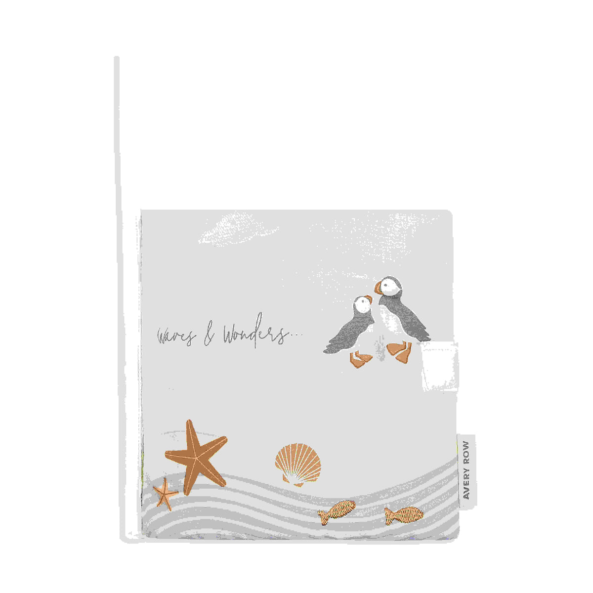 Front cover of the Waves & Wonders Coastline fabric book with puffin and seaside illustrations.