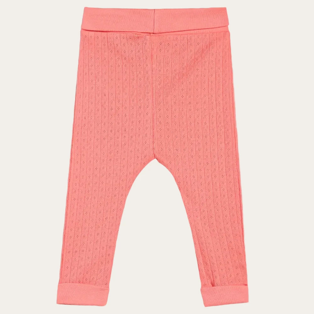 Coral textured baby leggings on a white background