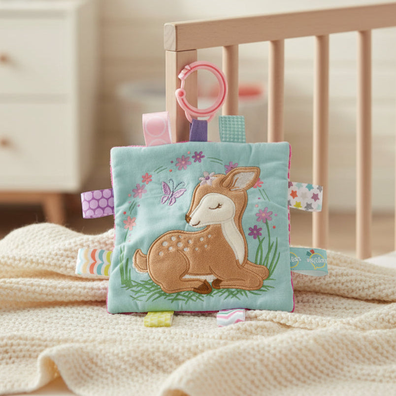 Crinkle Me deer Taggie Toy with colourful patterned tags and attachment loop.