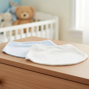 Two baby bibs, one with blue stripes and the other white with blue bears