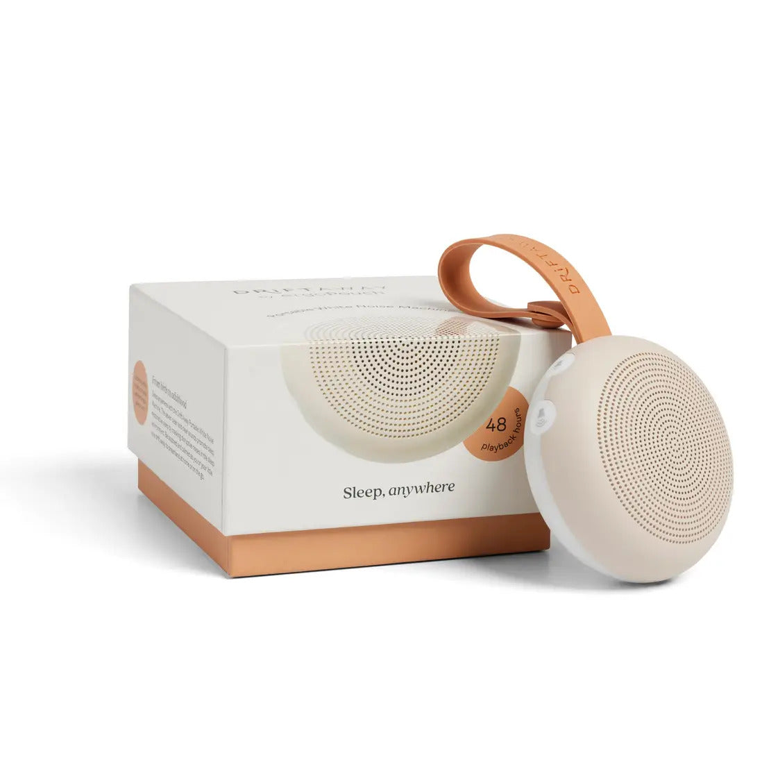 Taupe Drift Away sound machine standing beside its box, showing the circular speaker grille and tan loop.