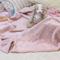 Dusky pink baby embossed blanket which has been personalised.