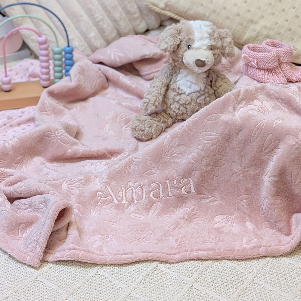 Dusky pink baby embossed blanket which has been personalised.