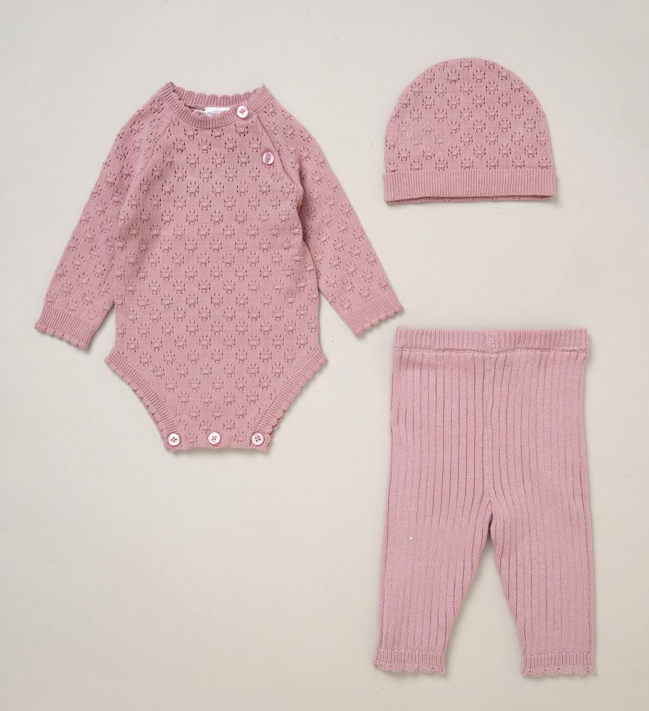 Dusky pink knit baby girl outfit set including bodysuit, hat and ribbed leggings displayed together as coordinated baby clothes.