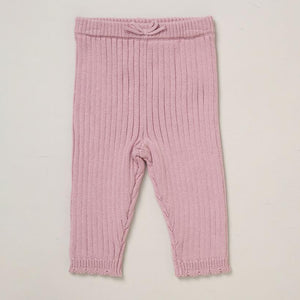 Dusky pink ribbed baby girl leggings in soft knit fabric from three piece baby clothes set.