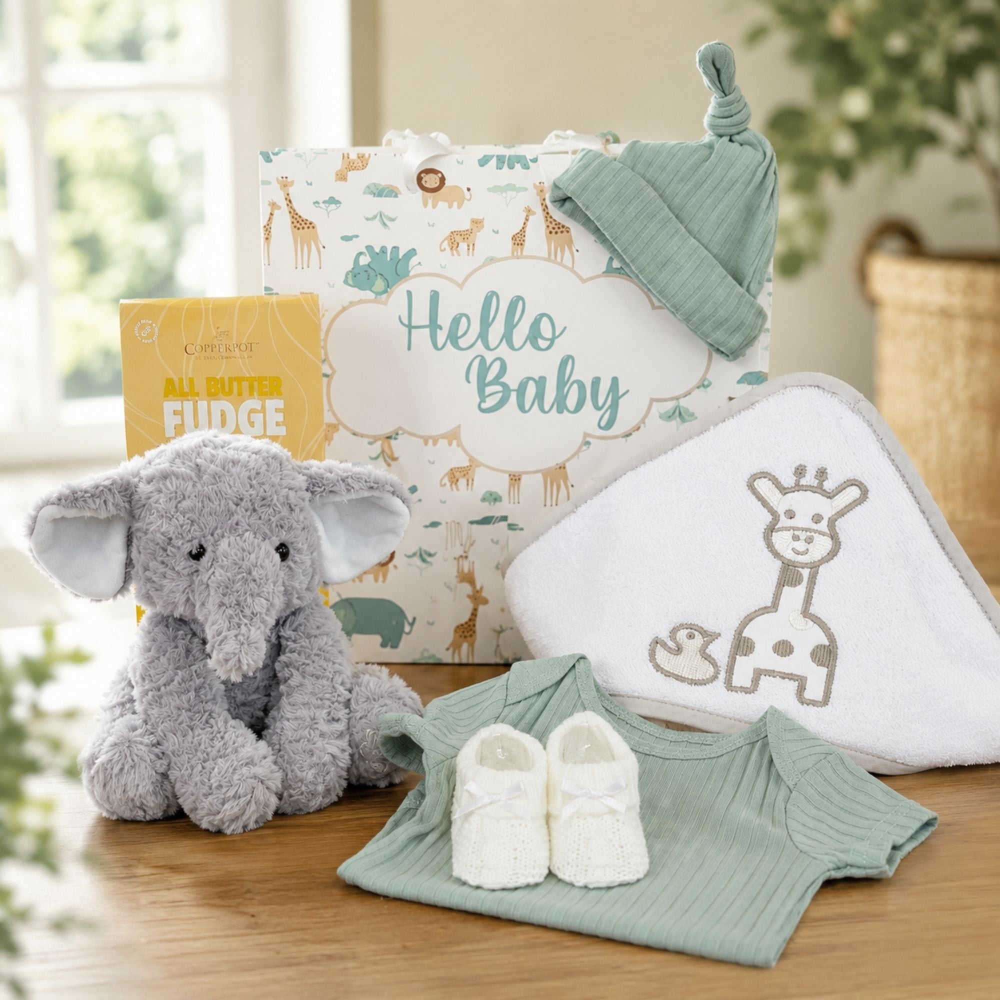 Eco friendly safari gifts for new baby to include elephant soft toy and hooded bath towel