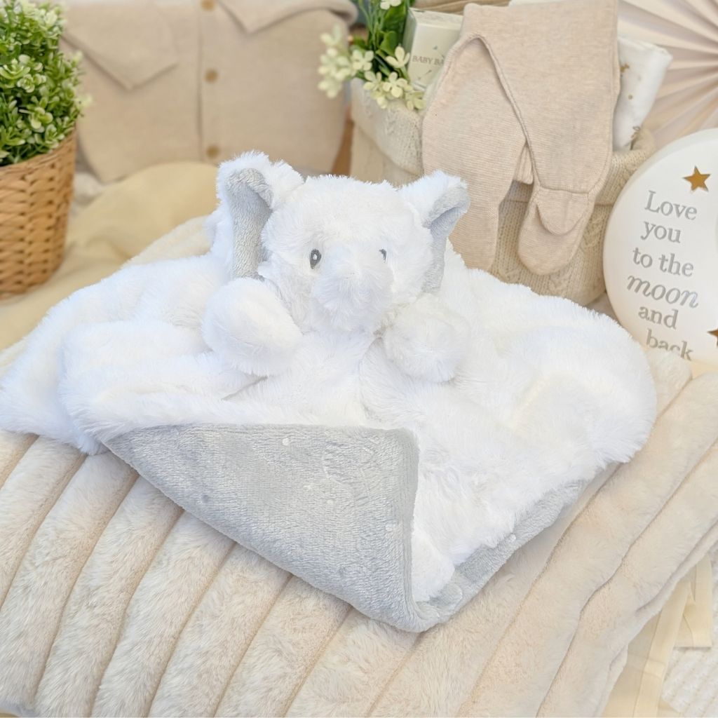 White plush elephant comforter with grey soft lining.