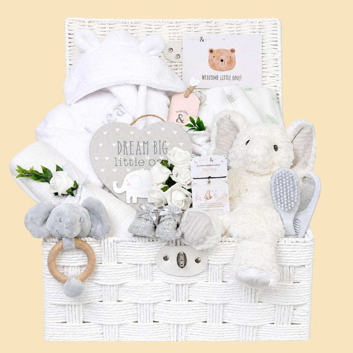 Baby gifts hamper with elephant soft toy, personalised baby bath robe and present for new parents.
