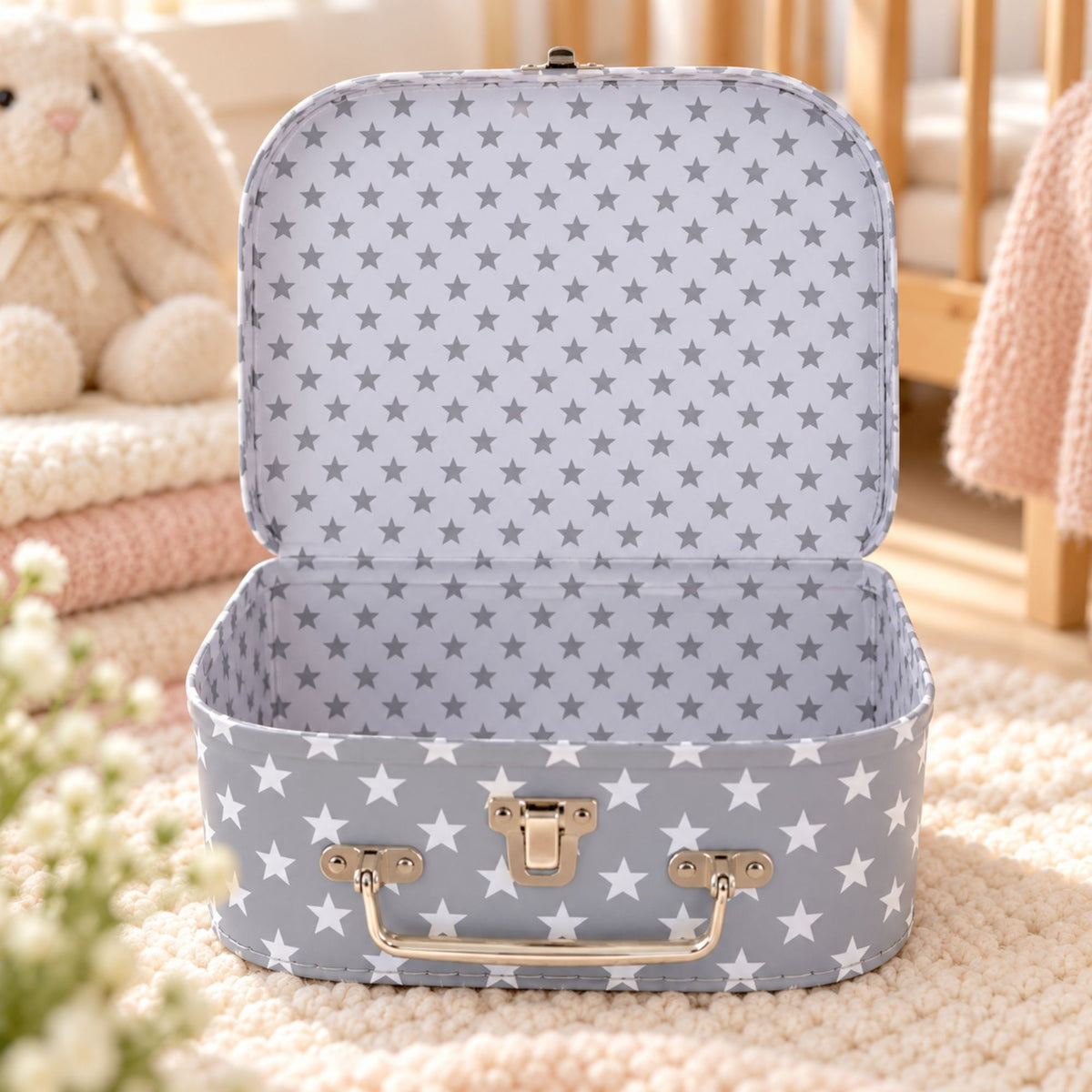 A light grey cardboard storage case with a star pattern